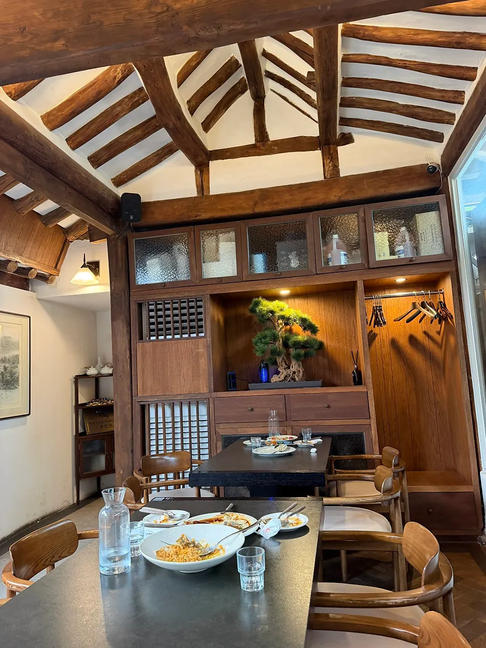 Dining hall at Concasse Anguk with courtyard tree visible