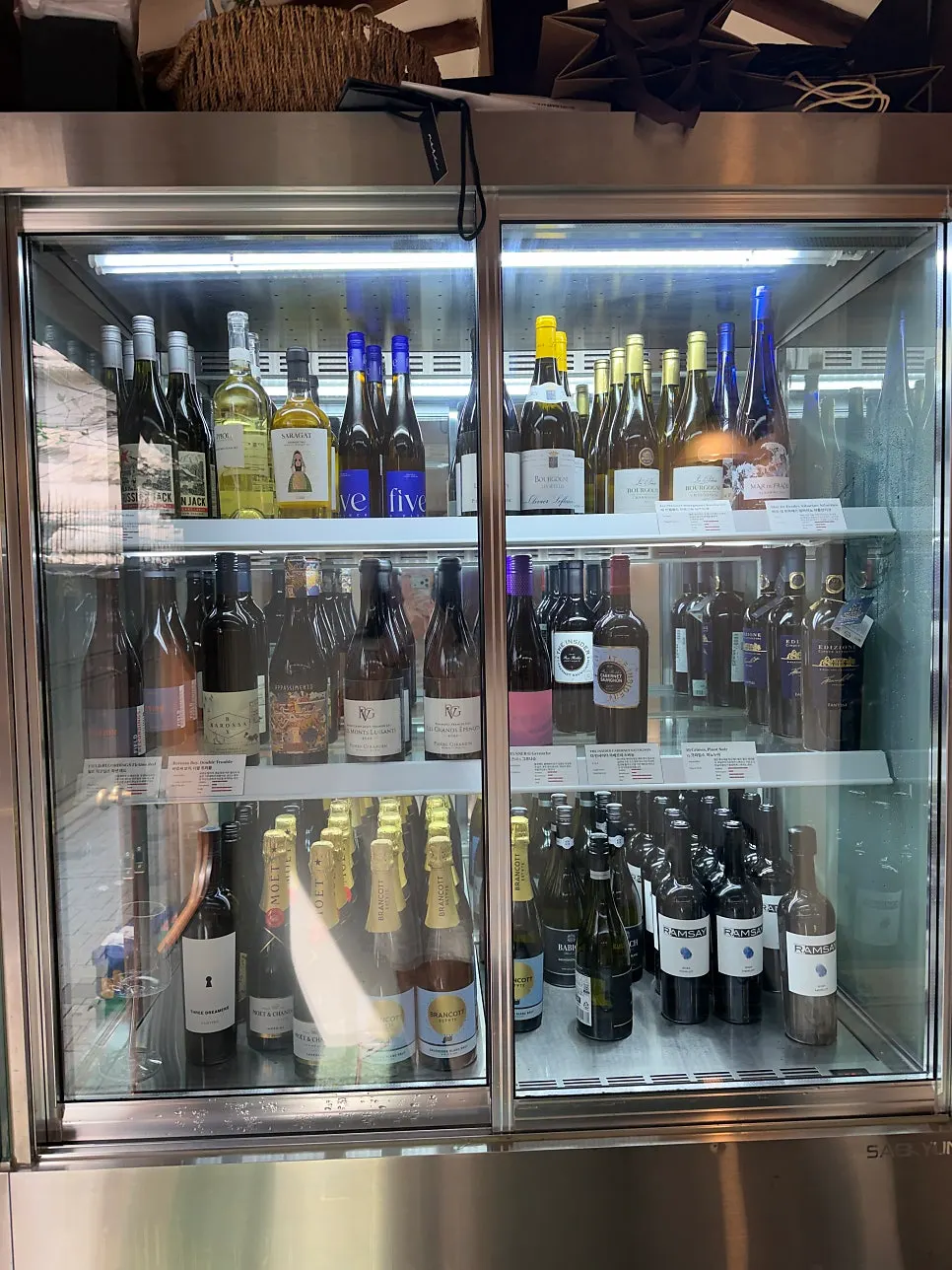 Large wine cellar along the restaurant wall