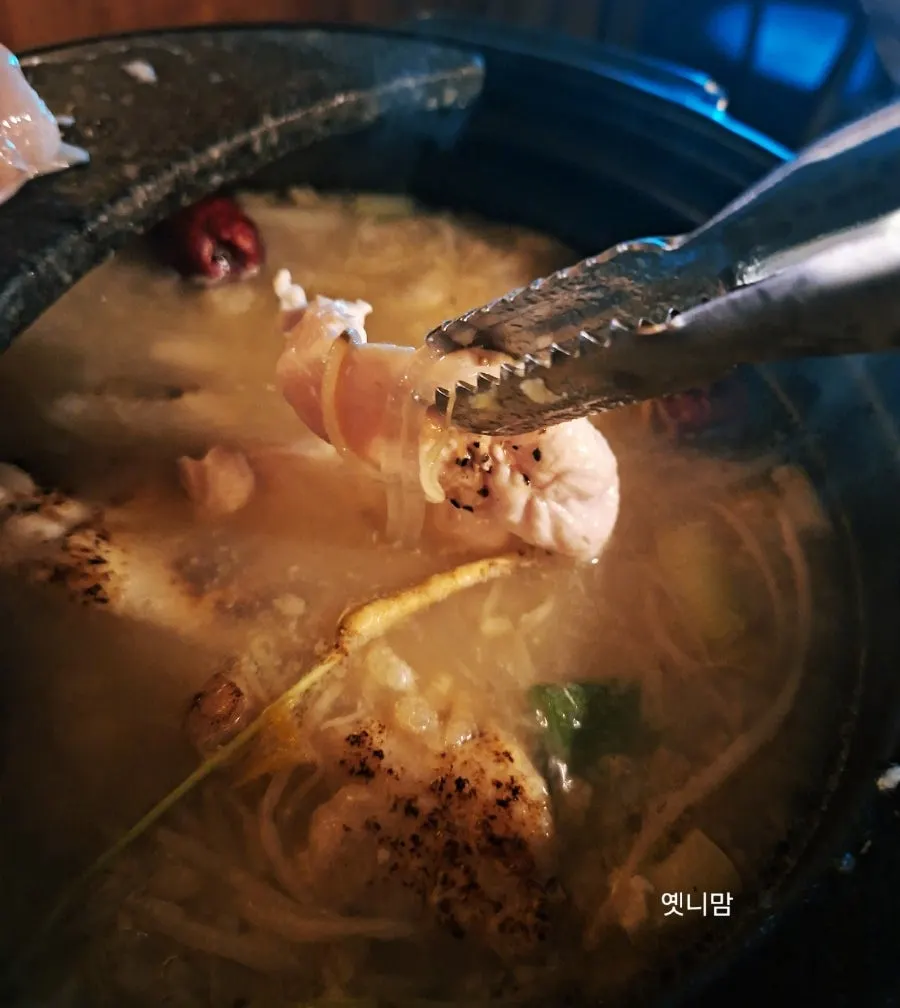Pot of chicken hot pot with scorched rice added