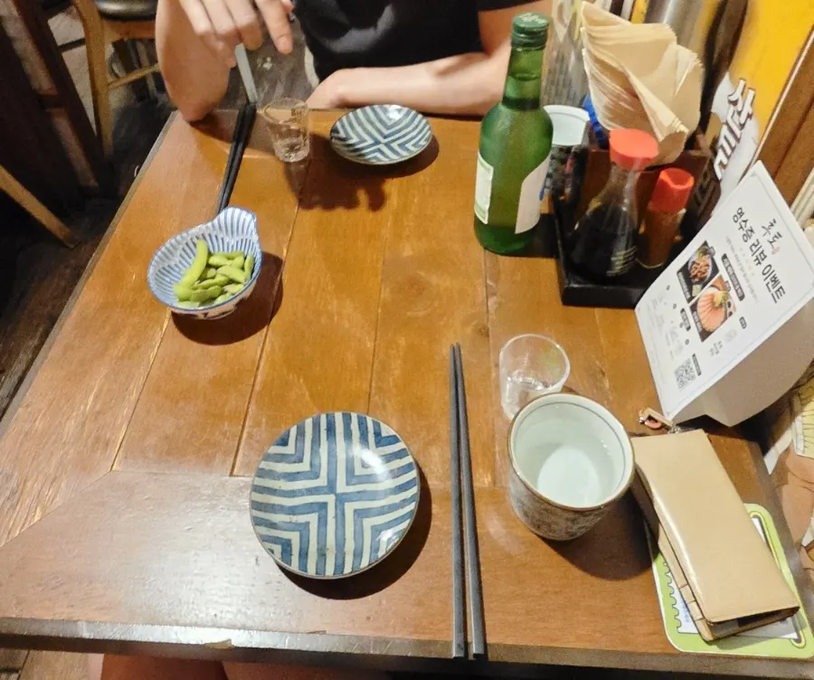 Table set with bar snacks and soju