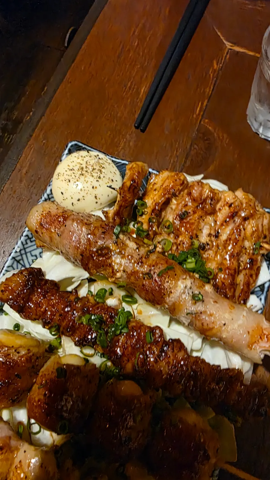 Skewers coated with sauce and charcoal aroma