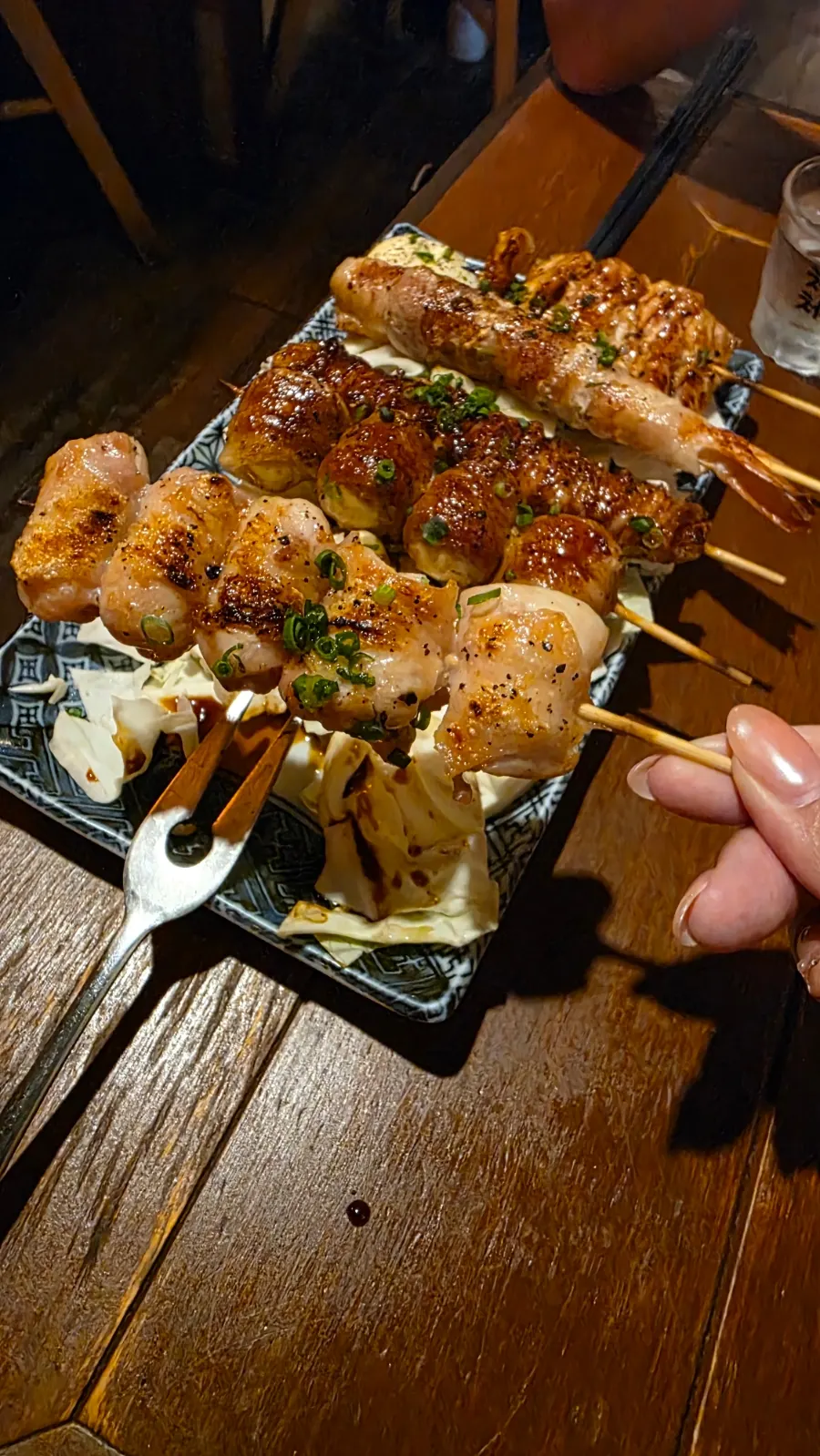 Skewers served with mayonnaise and cabbage