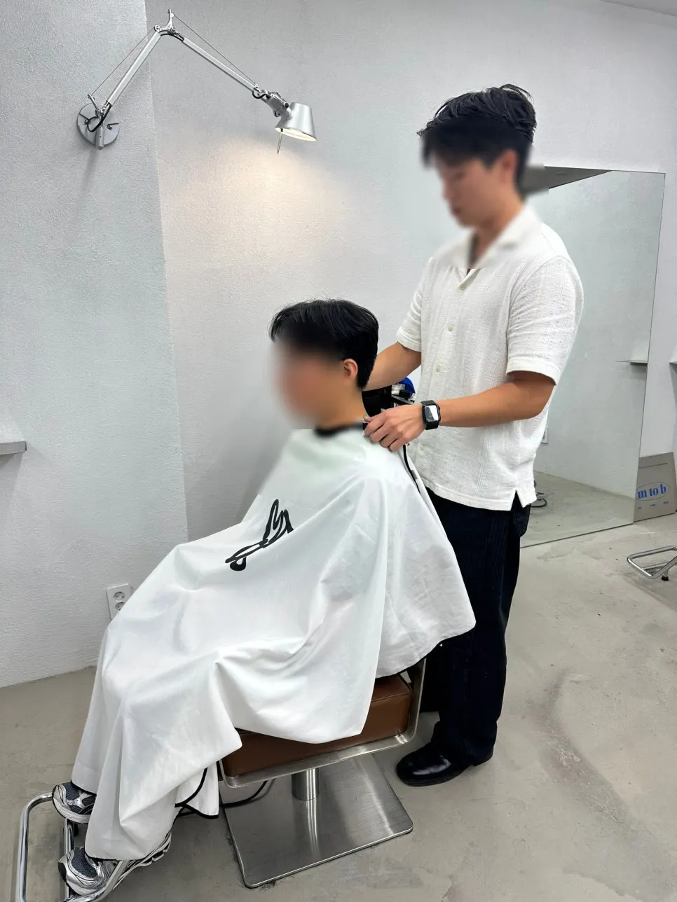 Hair consultation checking the husband's hair condition