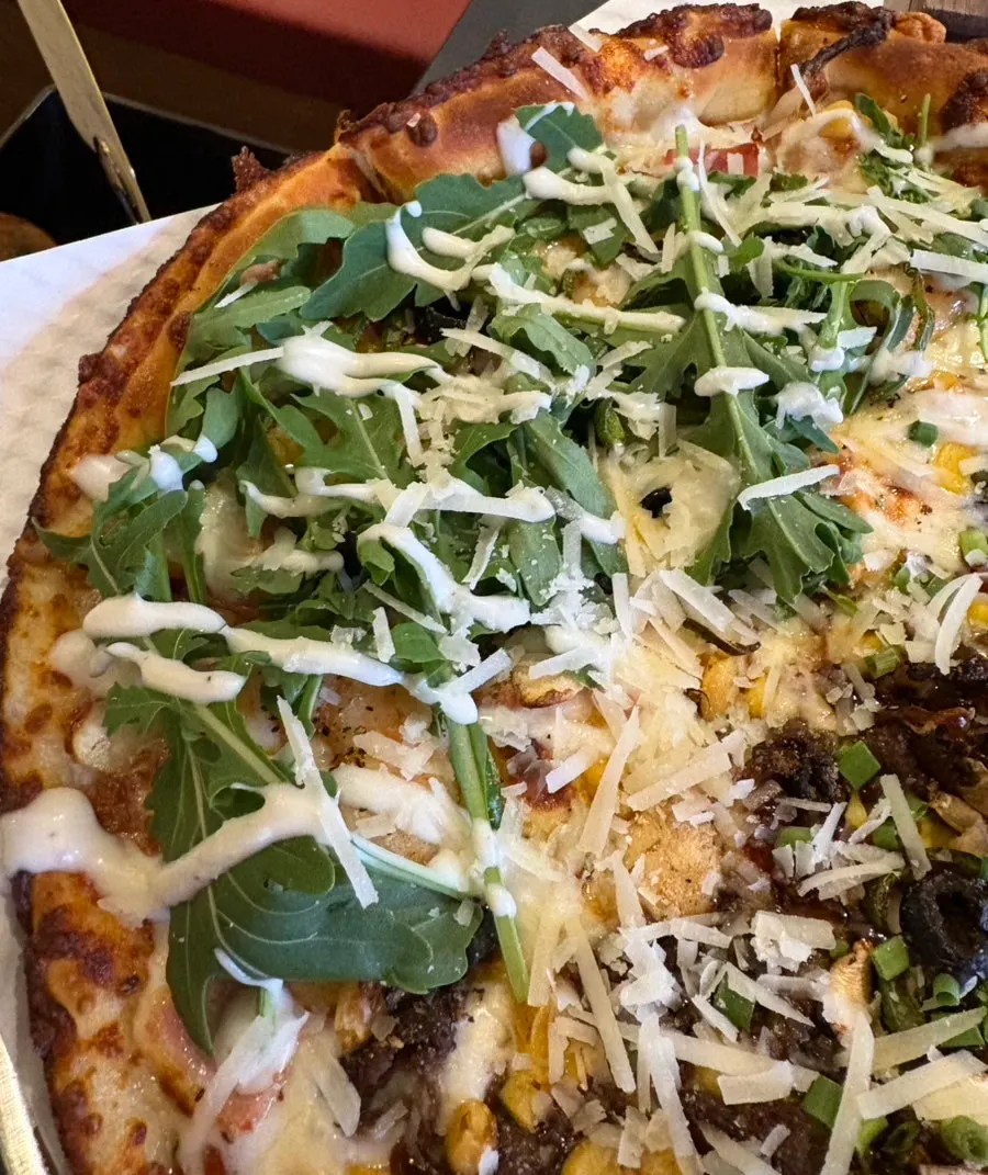 Half-and-half pizza set on the mini table stove