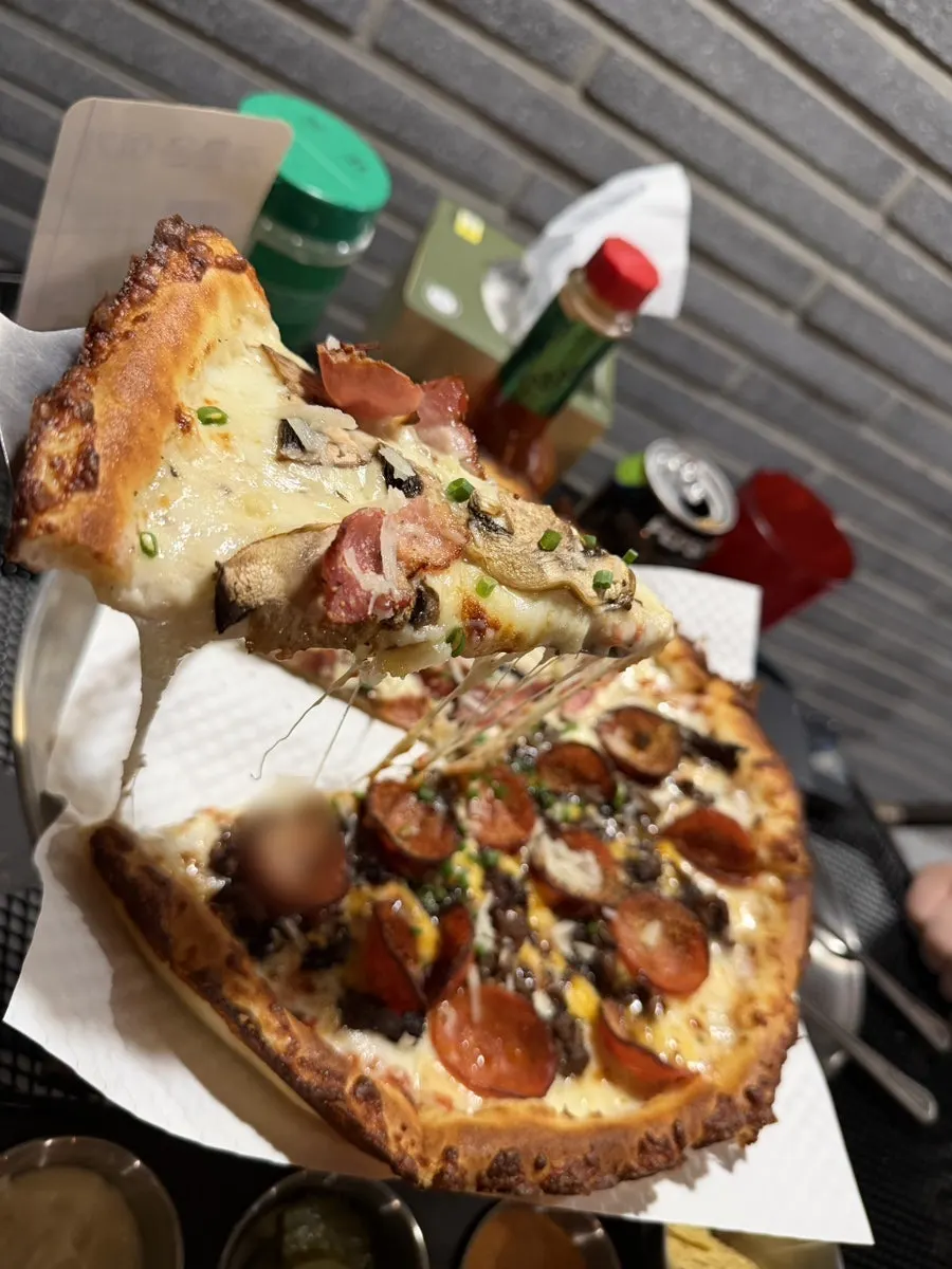 Half-and-half pizza with cream mushroom bacon and pepperoni bolognese