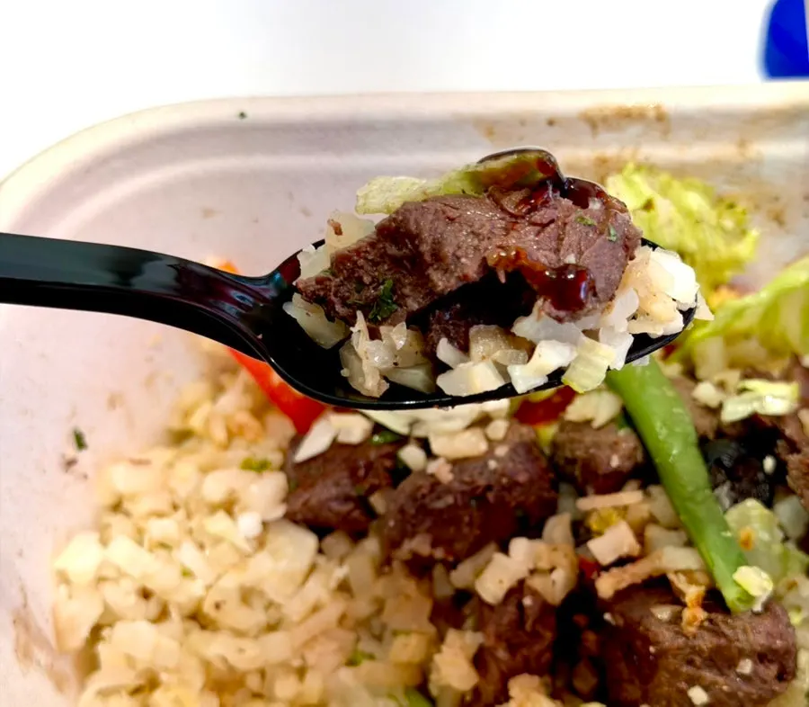 The dipping sauce served separately alongside the beef
