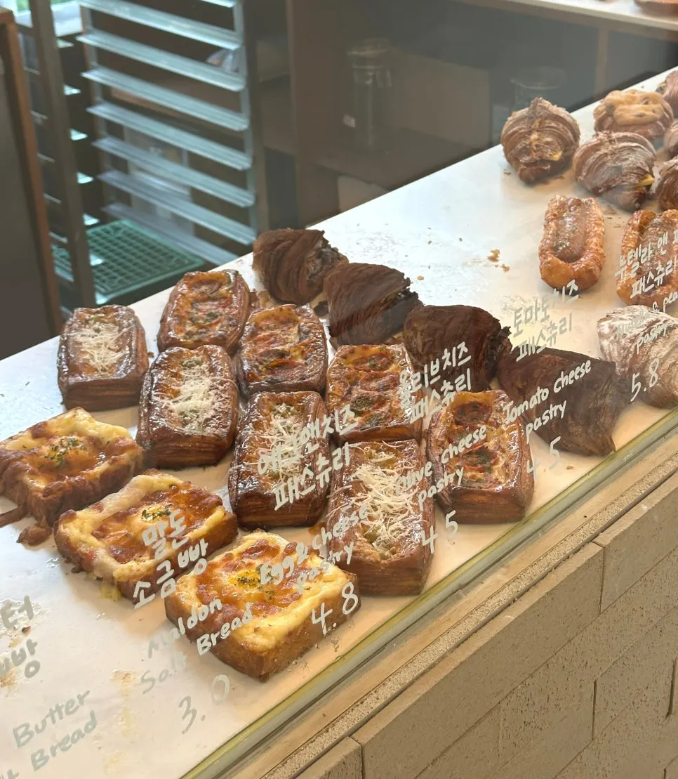 Bread display shelves and menu labels at Stack Bakery