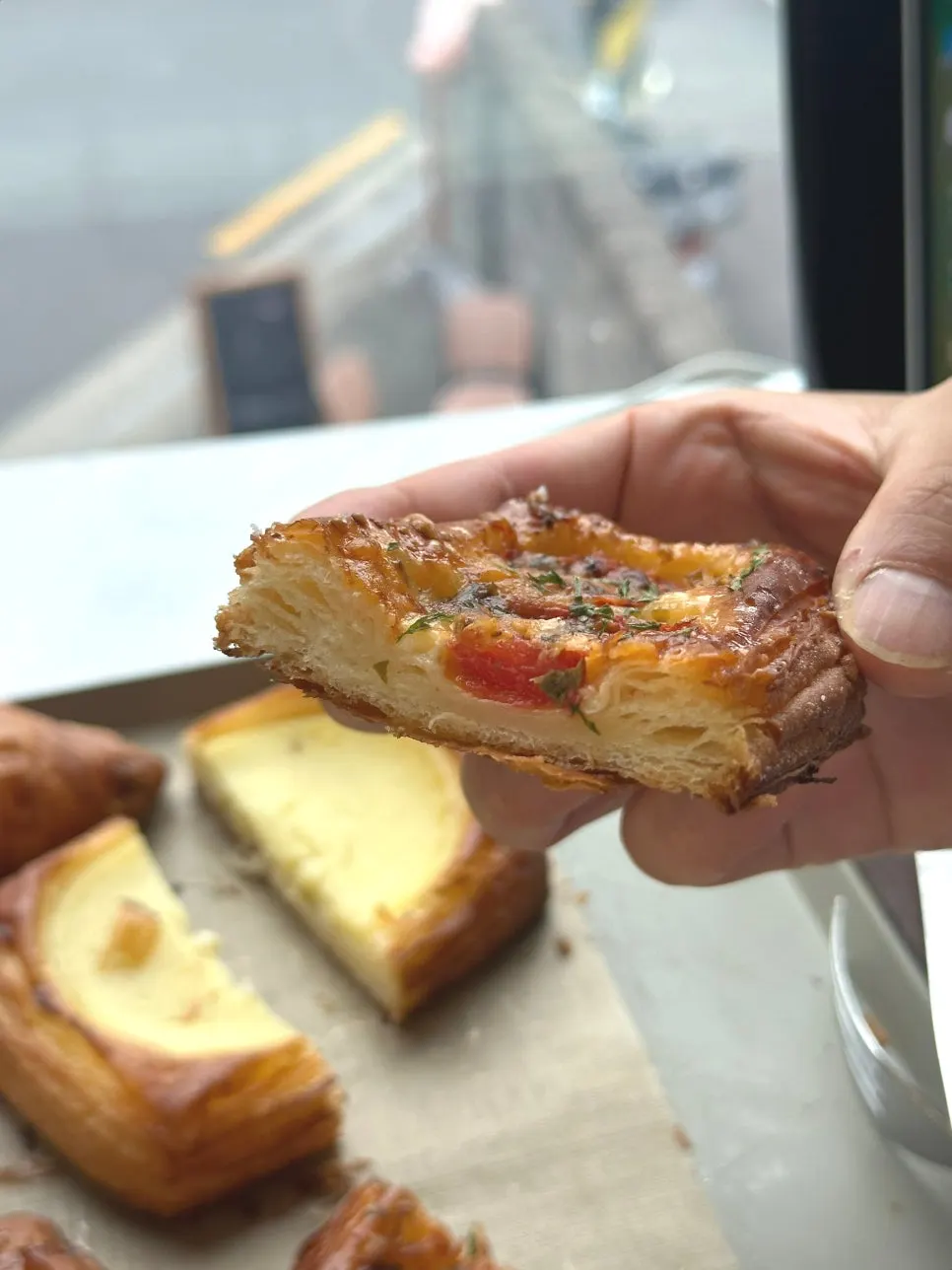 Cross-section of the tomato cheese pastry with melted cheese