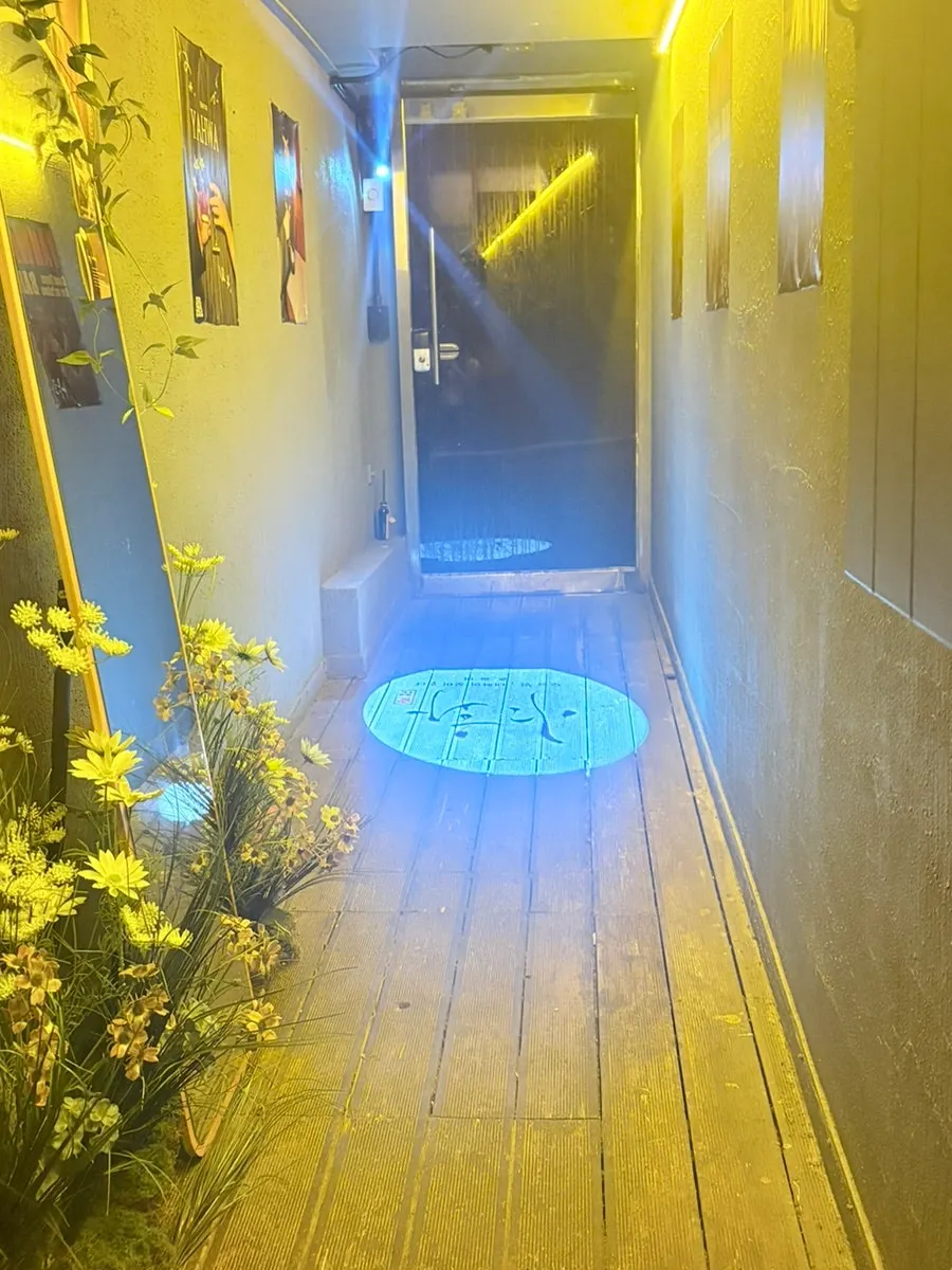 Bar hallway with warm orange lighting