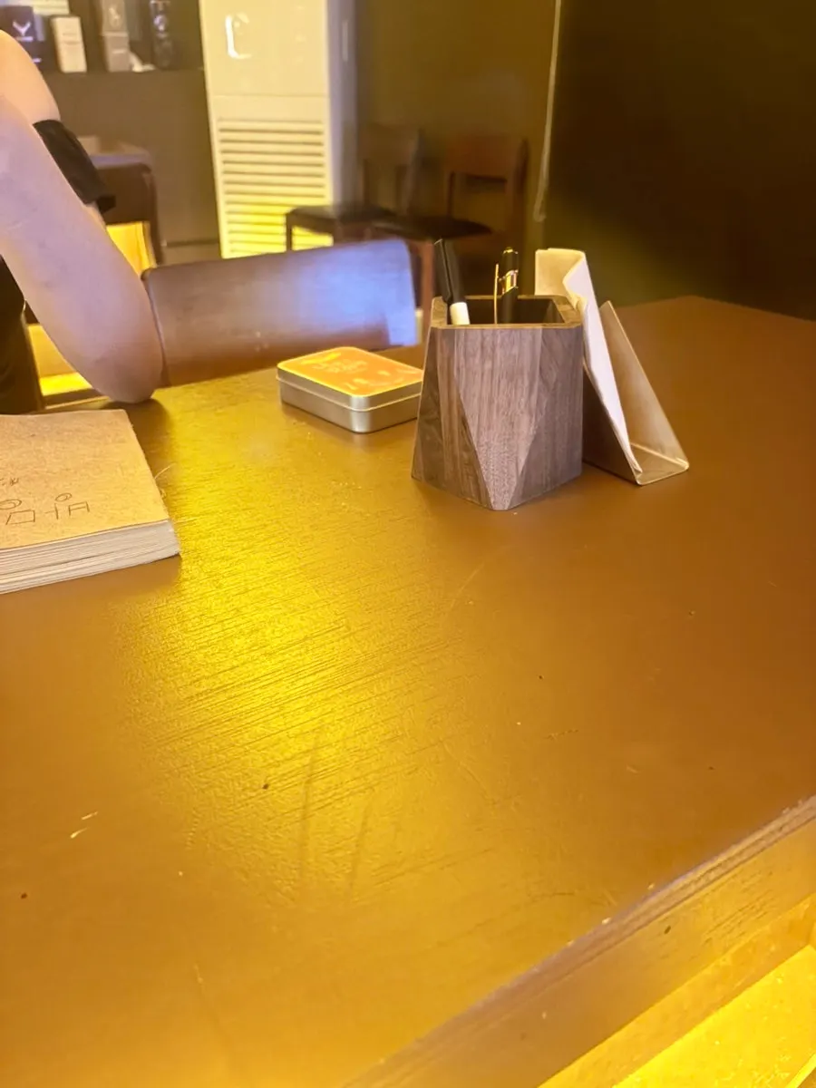 Guestbook notebook and small objects on the bar table