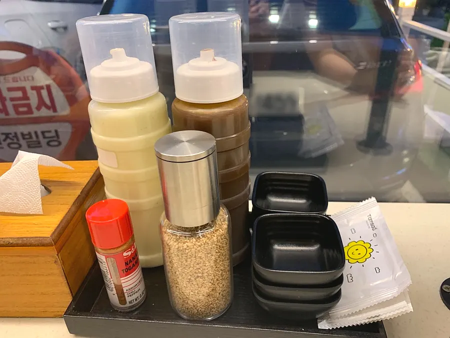 Tonkatsu sauce and sesame seeds on the table