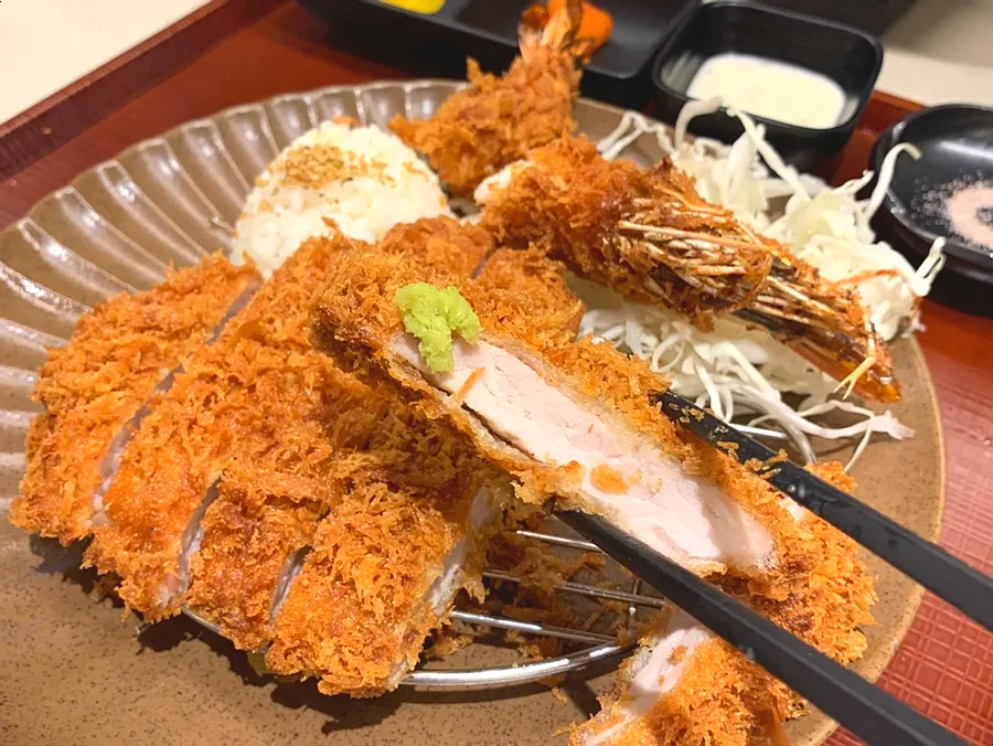 A piece of tonkatsu topped with wasabi
