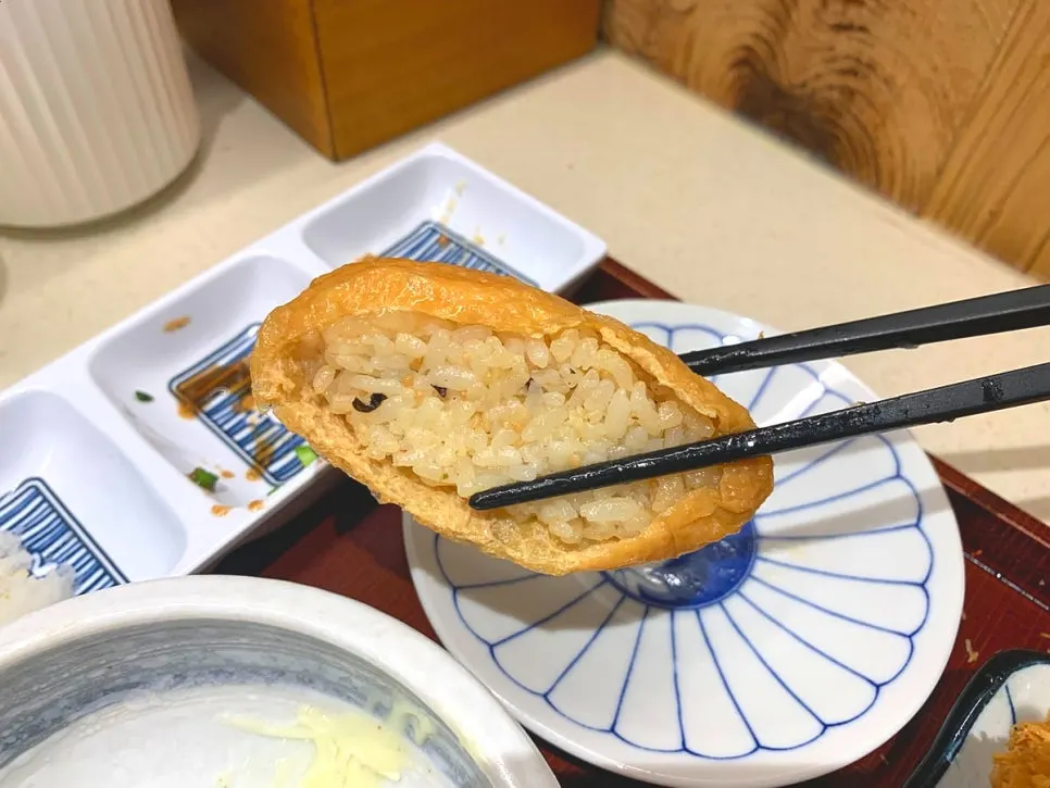 Inari sushi served alongside the udon