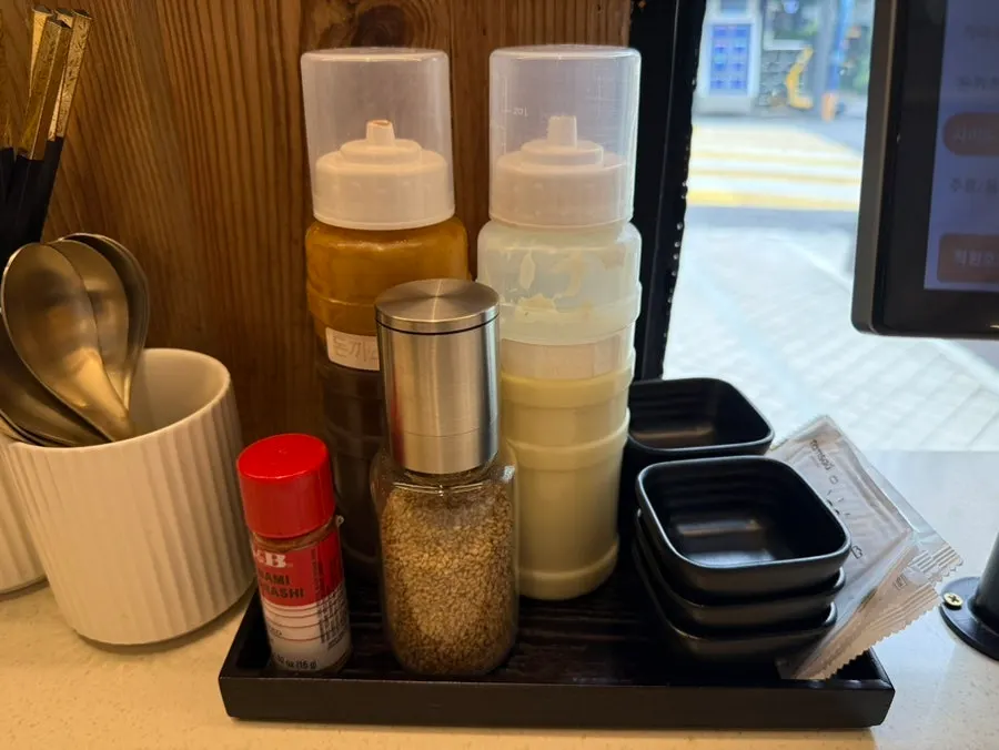 Self-serve bar with aprons and sauces