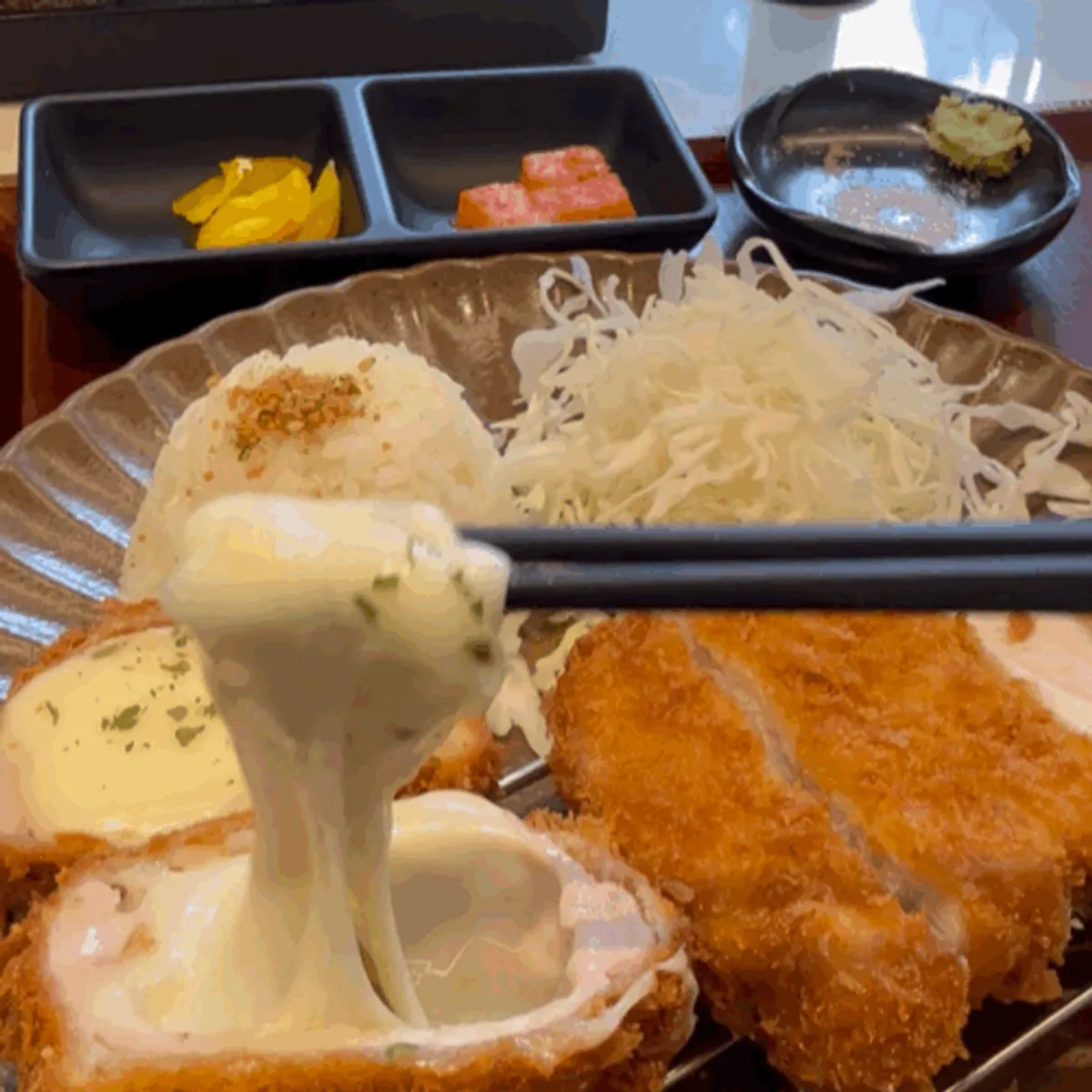 Close-up of cheese stretching from the tonkatsu