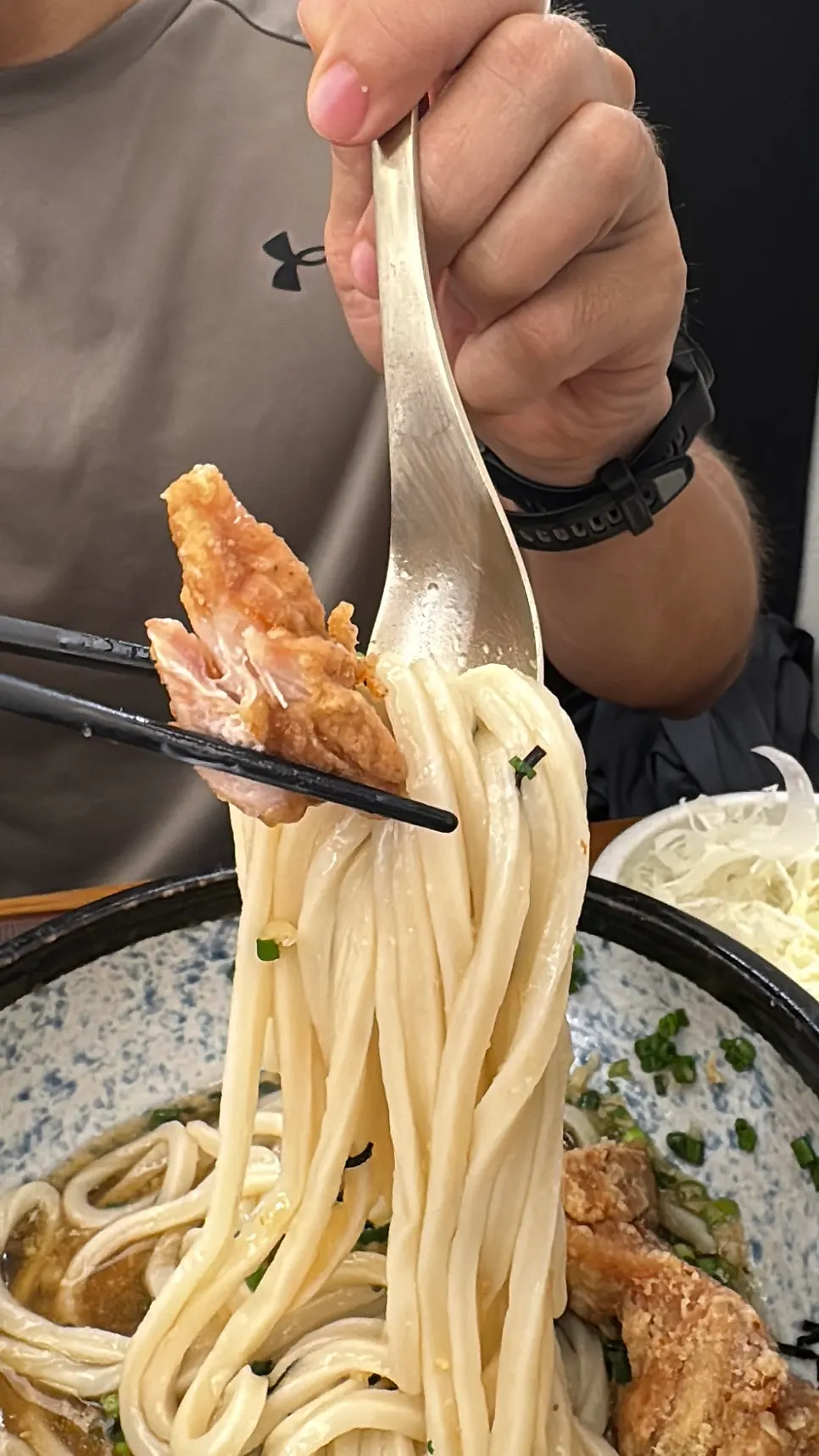 Toriten fried chicken placed on top of the udon noodles