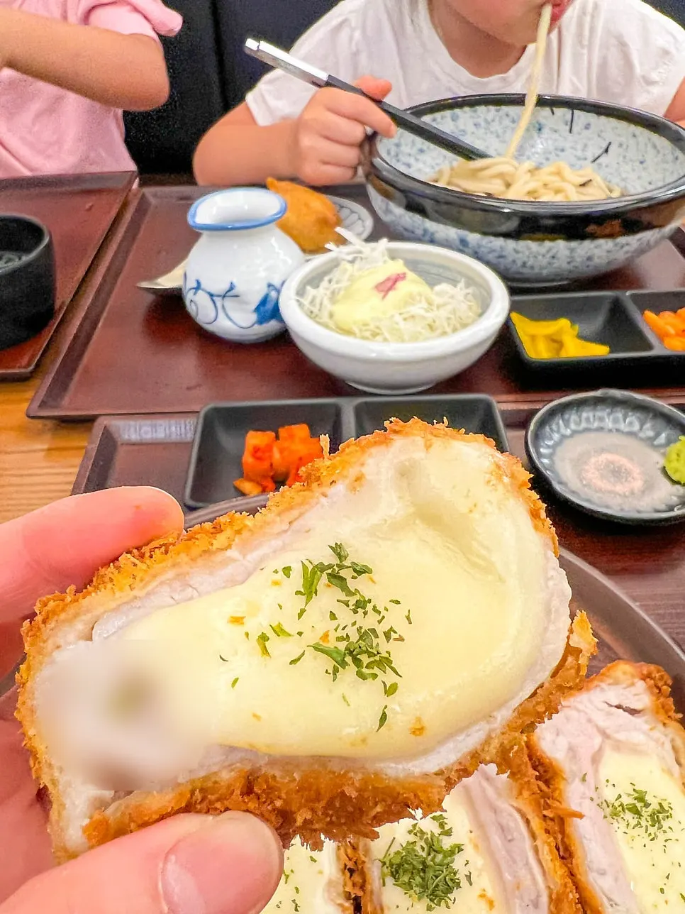 A piece of cheese tonkatsu stretching long