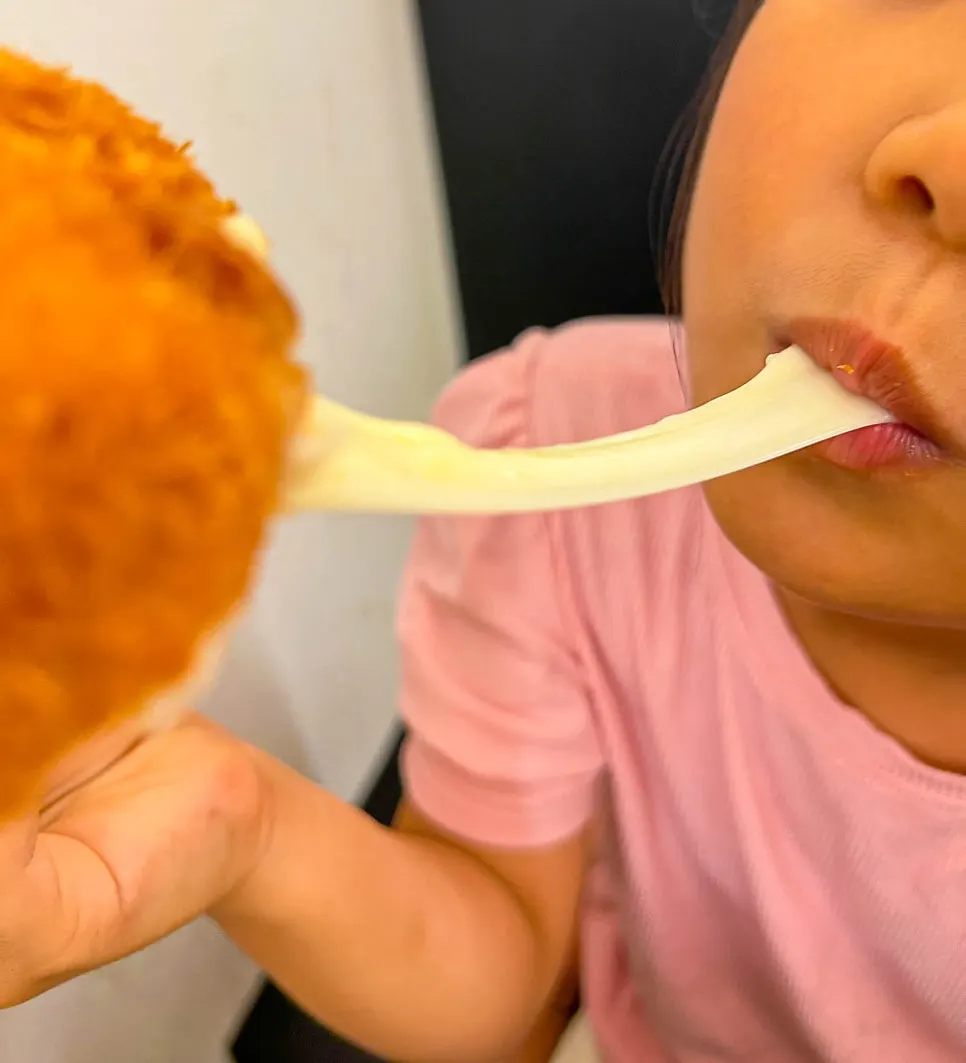 Kids eating cheese tonkatsu together
