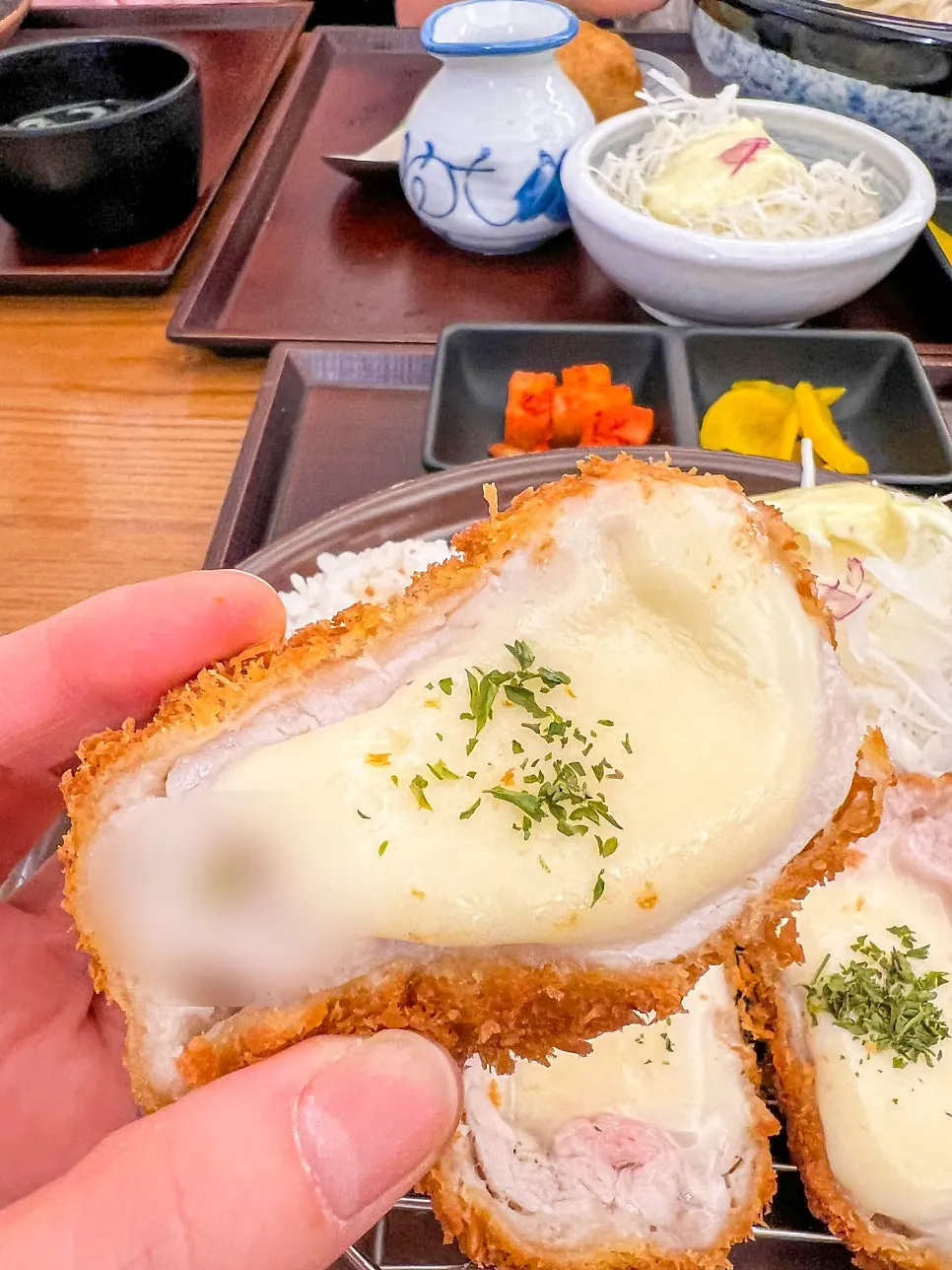 Table set with both cheese tonkatsu and bukkake udon