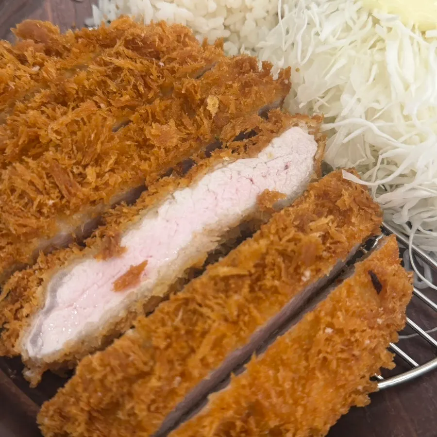 Cross-section of tonkatsu packed with meat