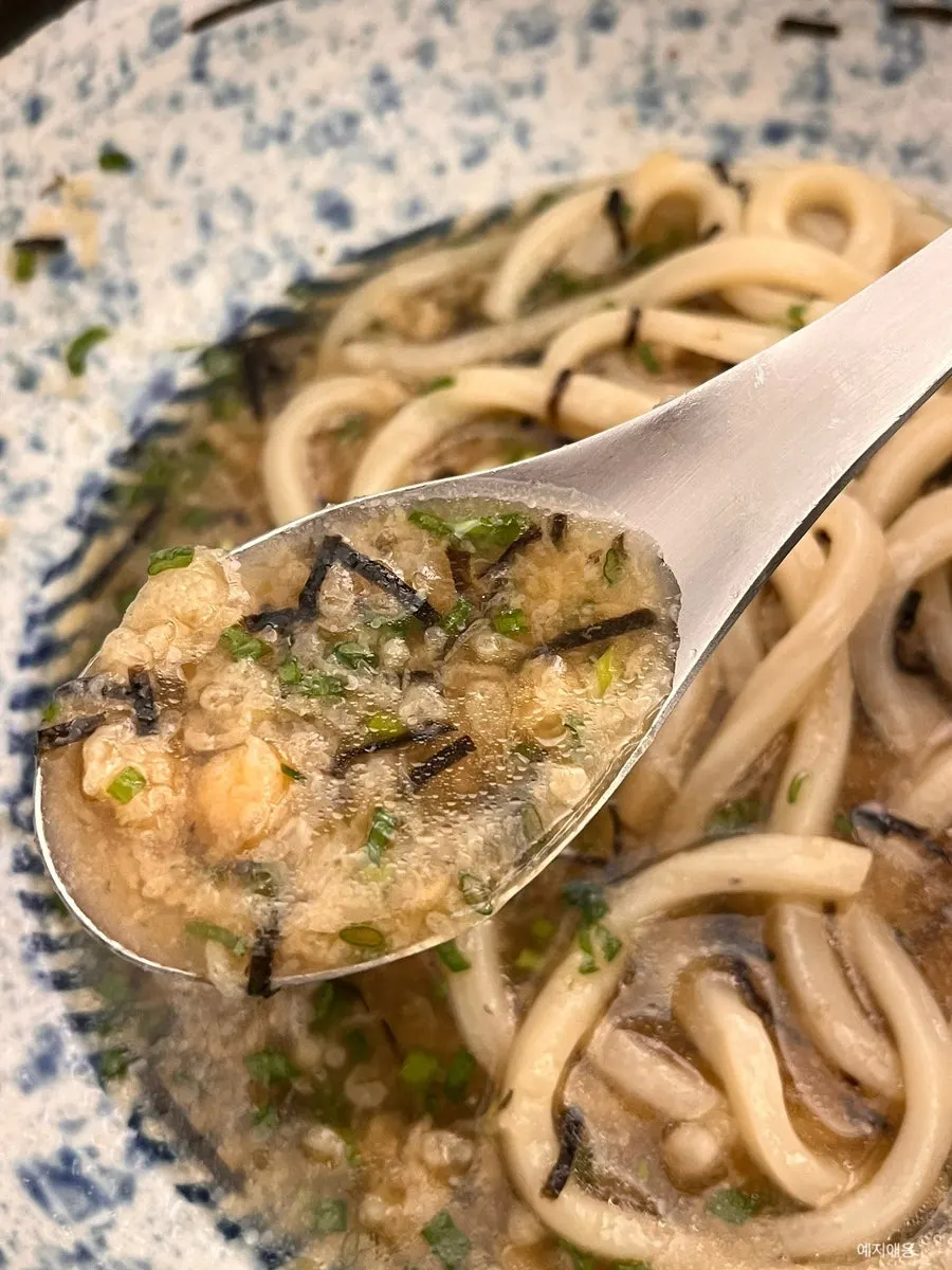 Cold bukkake udon broth after the sauce is poured in
