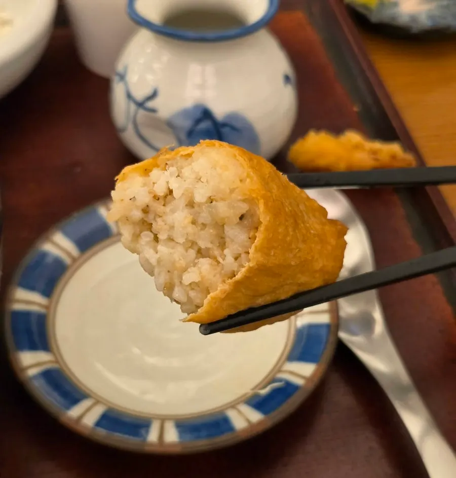 Inari sushi served alongside the udon