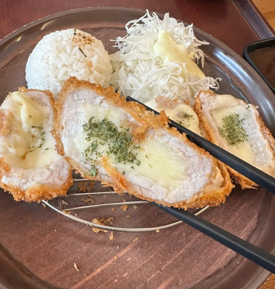 Cross-section of cheese katsu showing melted cheese