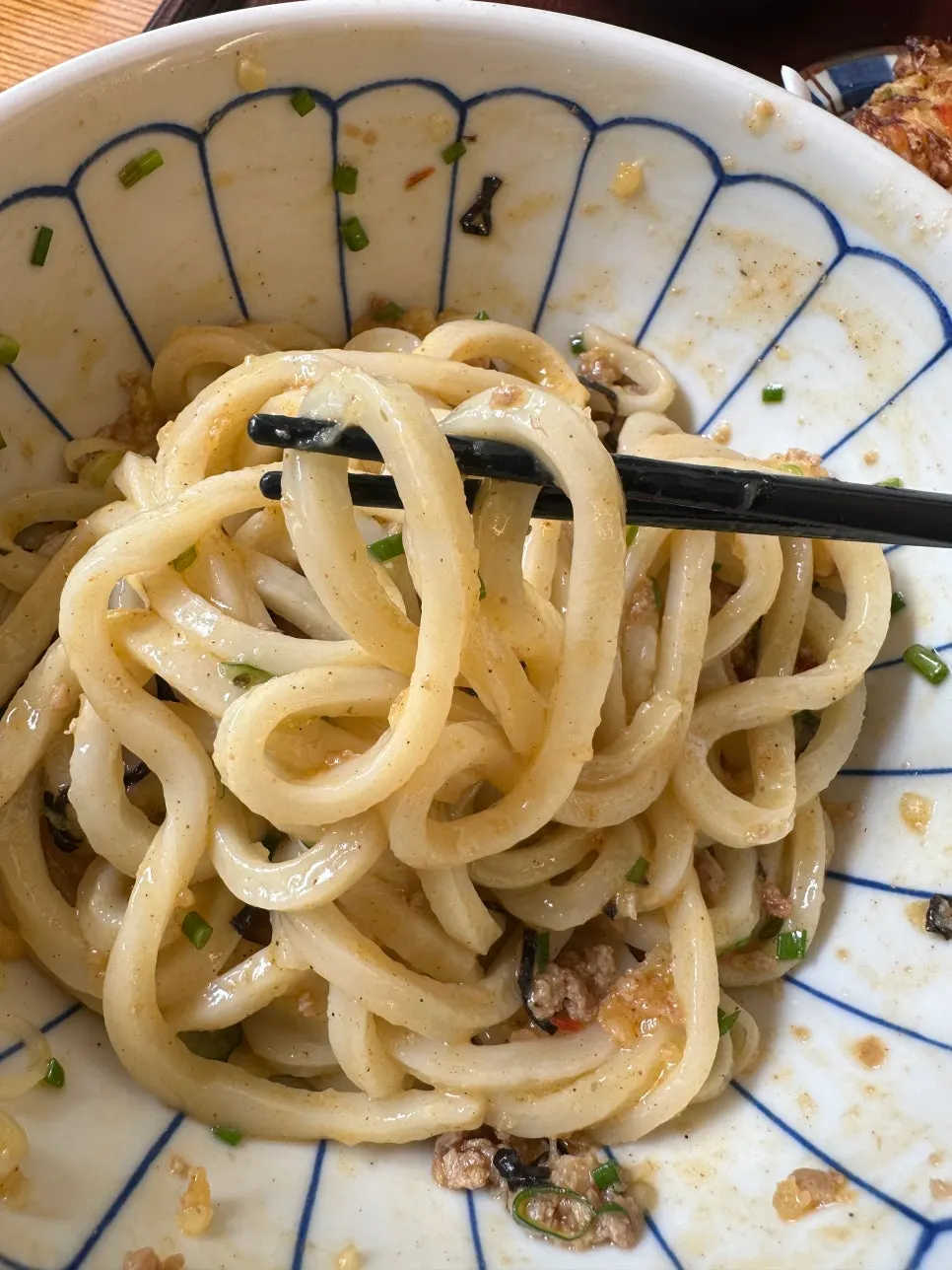 Close-up of mazesoba udon with egg yolk and minced meat