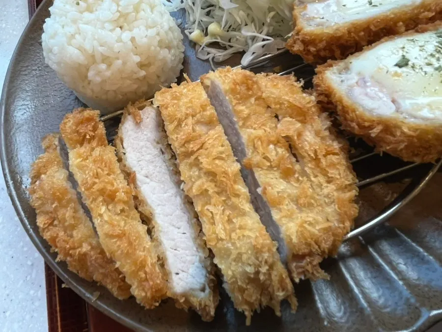Cross-section of crispy-breaded fresh pork loin tonkatsu