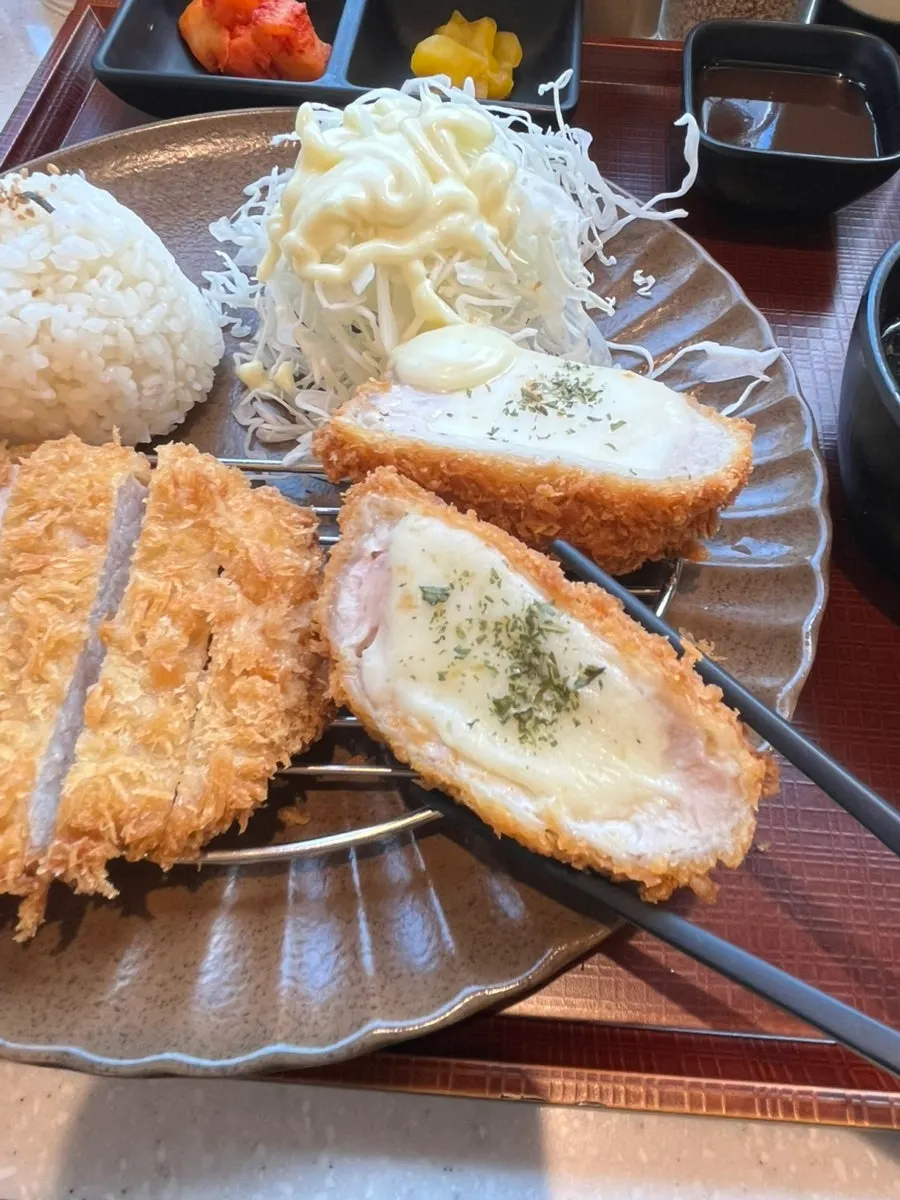 Cross-section of cheese katsu packed with melted cheese