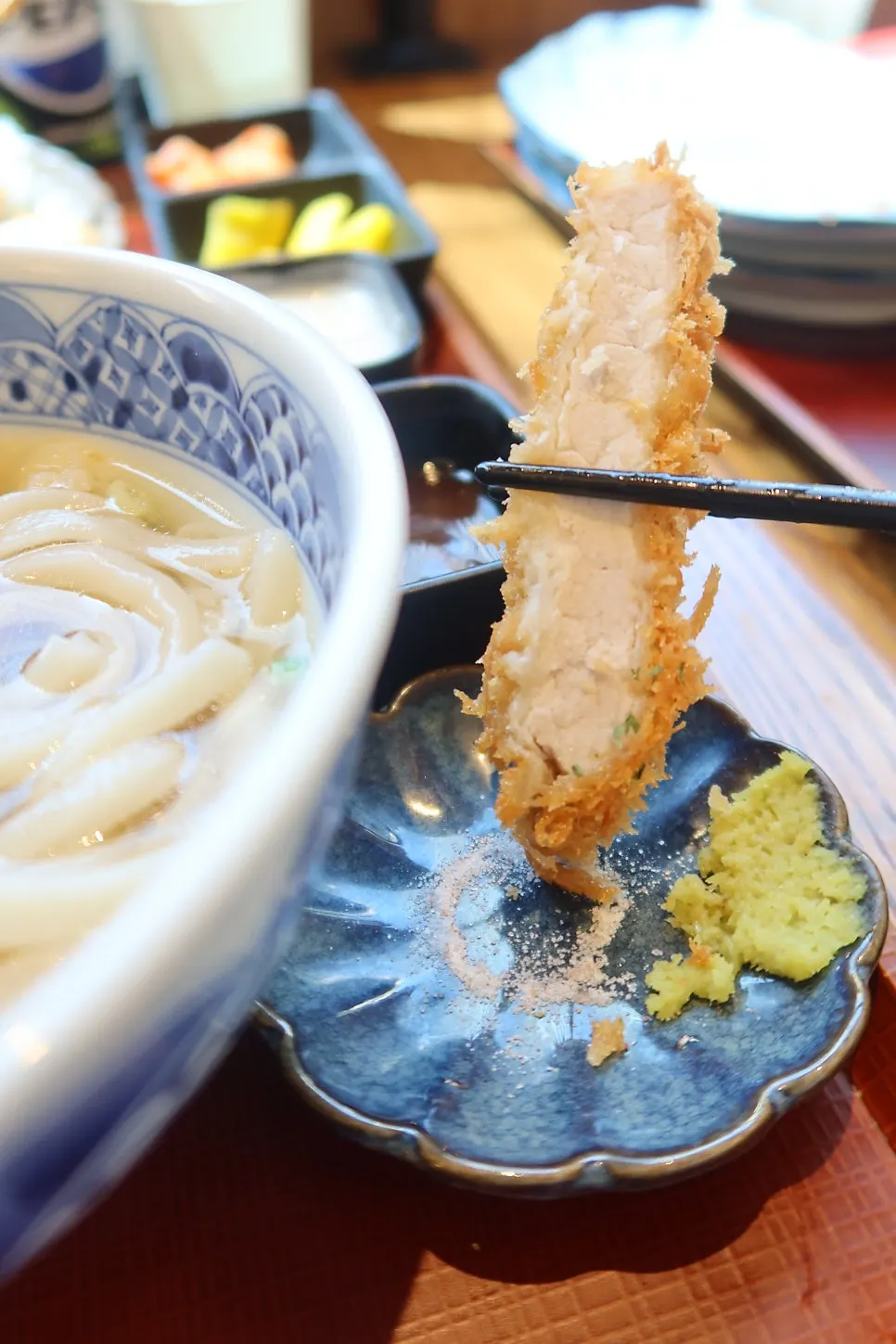 Table setting with tonkatsu sauce, salt, and wasabi