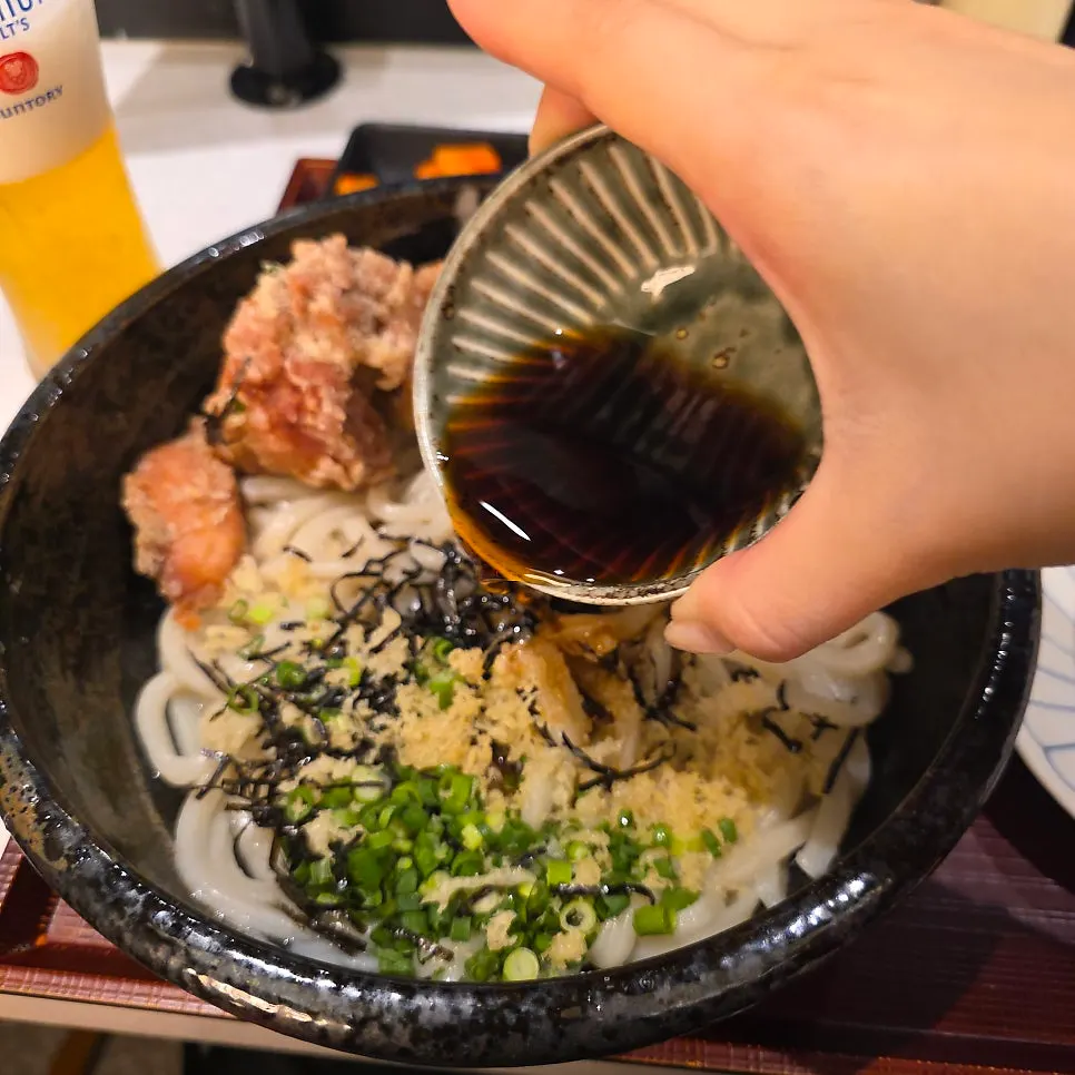Warm udon noodles with sauce added