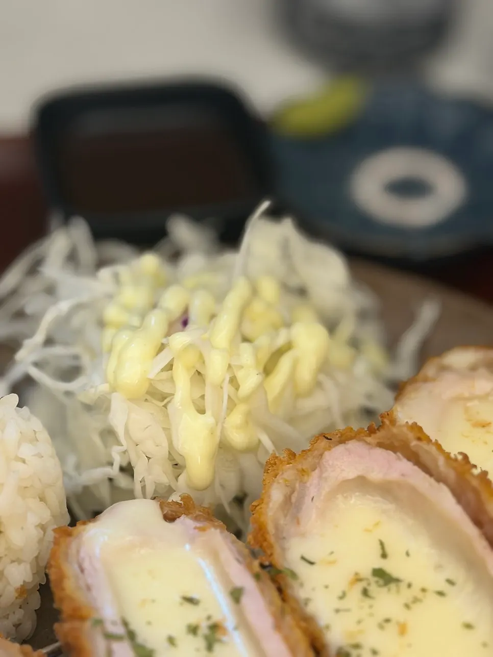 Cheese katsu served with cabbage salad