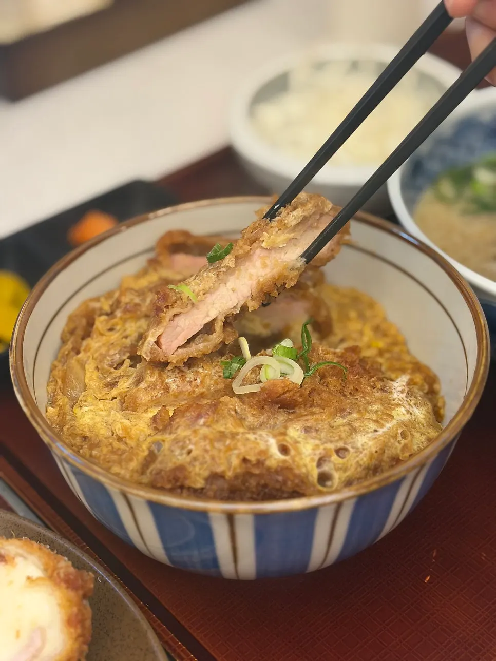 Egg and tonkatsu on top of the spicy katsudon