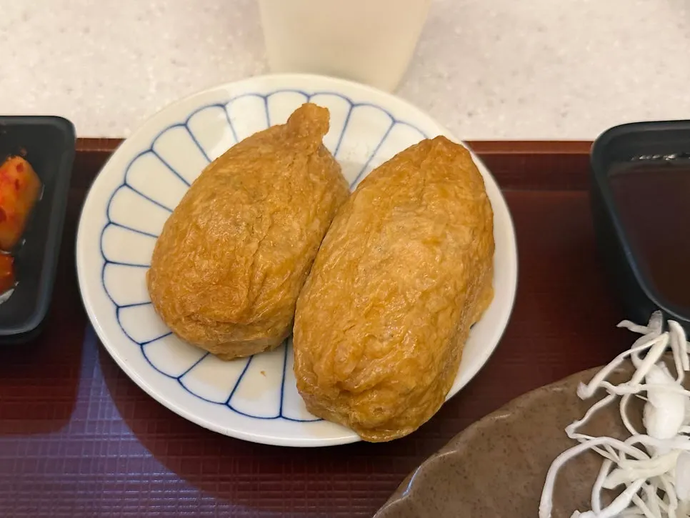 Two pieces of inari sushi ordered as a side