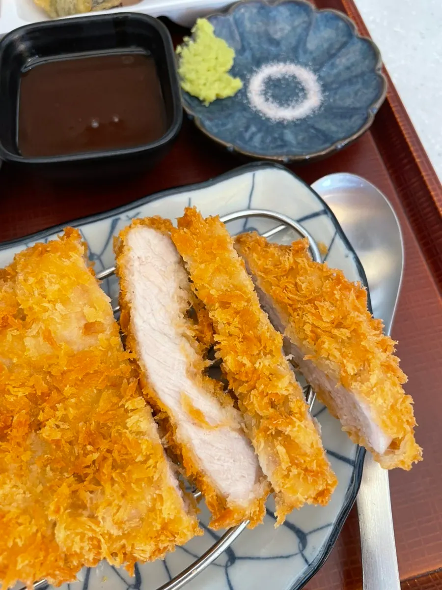 Plate of pork loin tonkatsu served with the set