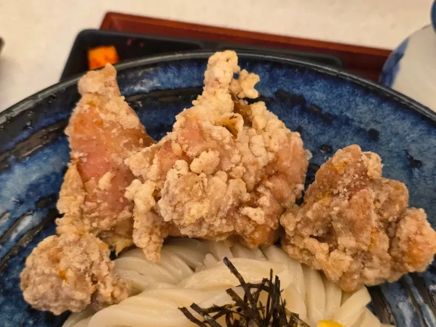 Three large pieces of fried chicken on top of the tori-ten