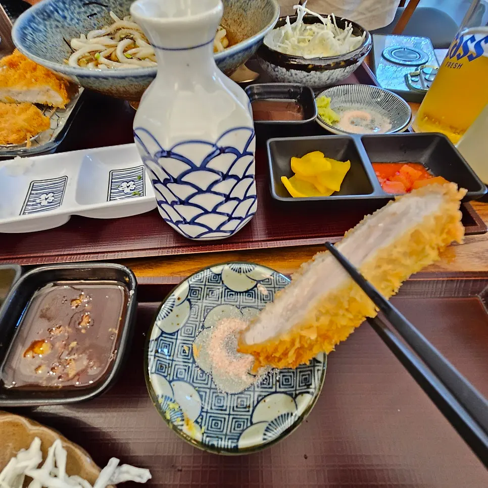 A piece of tonkatsu served with pink salt