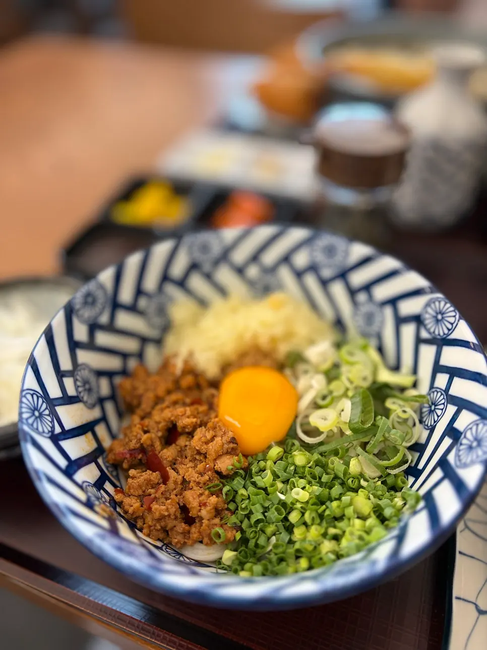 Mazeudon topped with minced meat and egg yolk