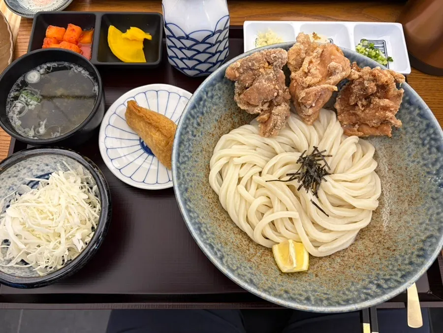 Plain udon order served with fried tofu rice pouch, salad and kimchi