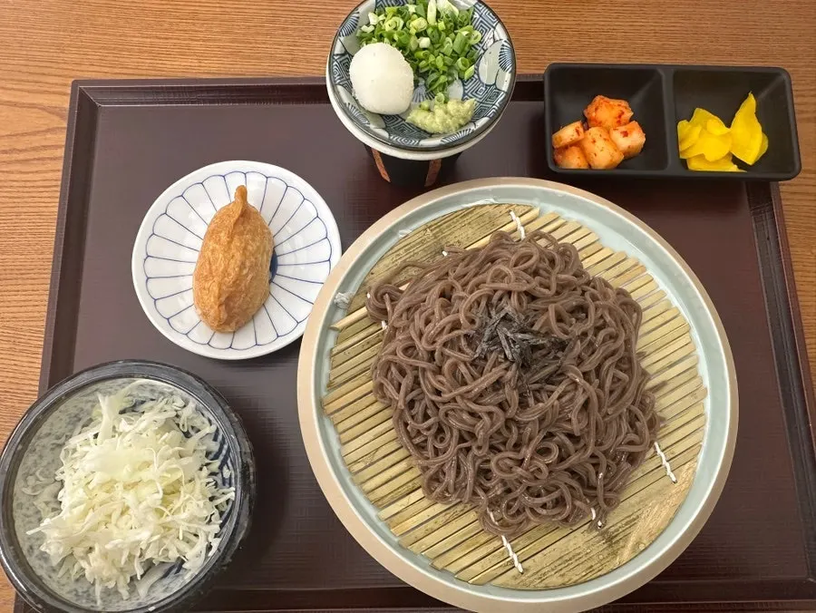 Zaru soba topped with shaved ice, served with tsuyu and grated radish on the side