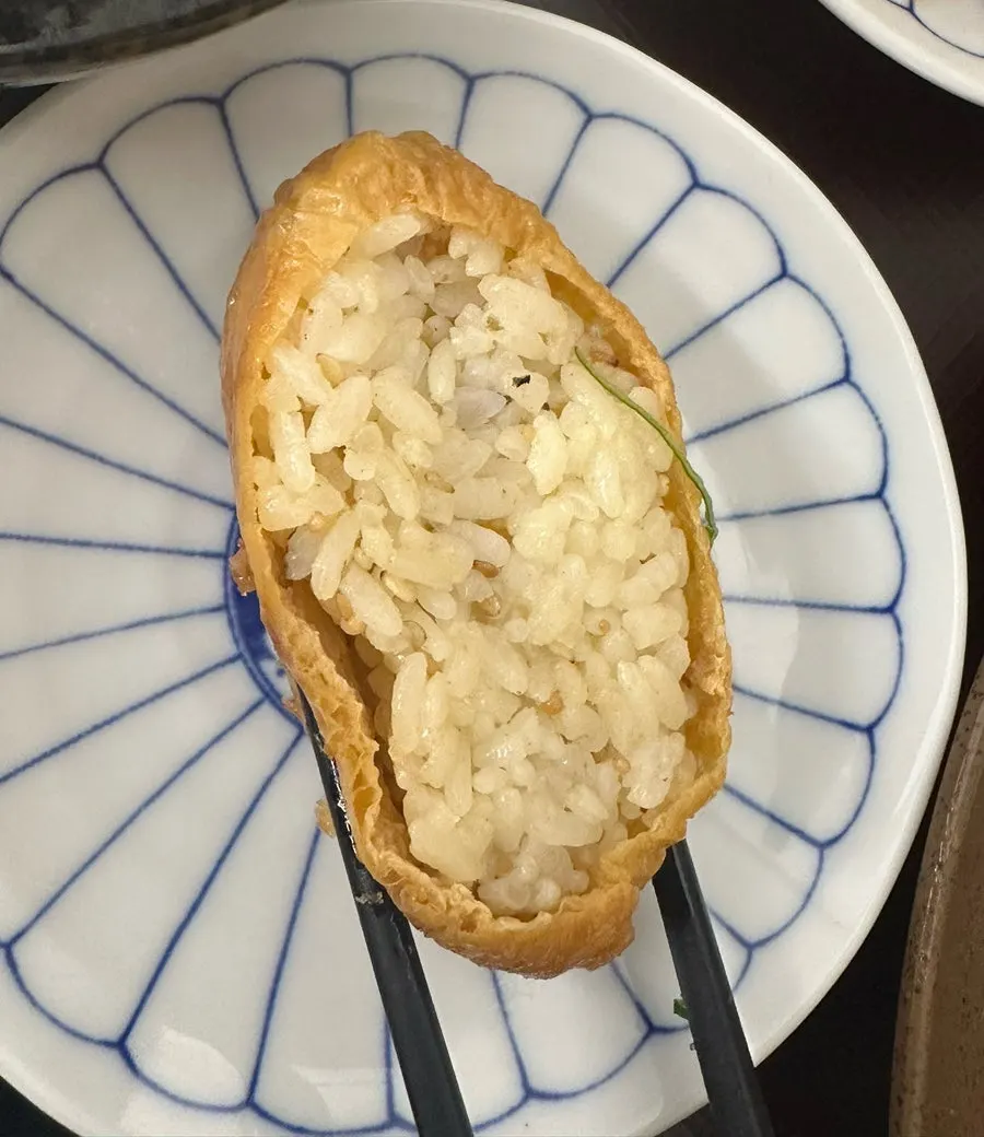 A single piece of inari served alongside the half-and-half katsu