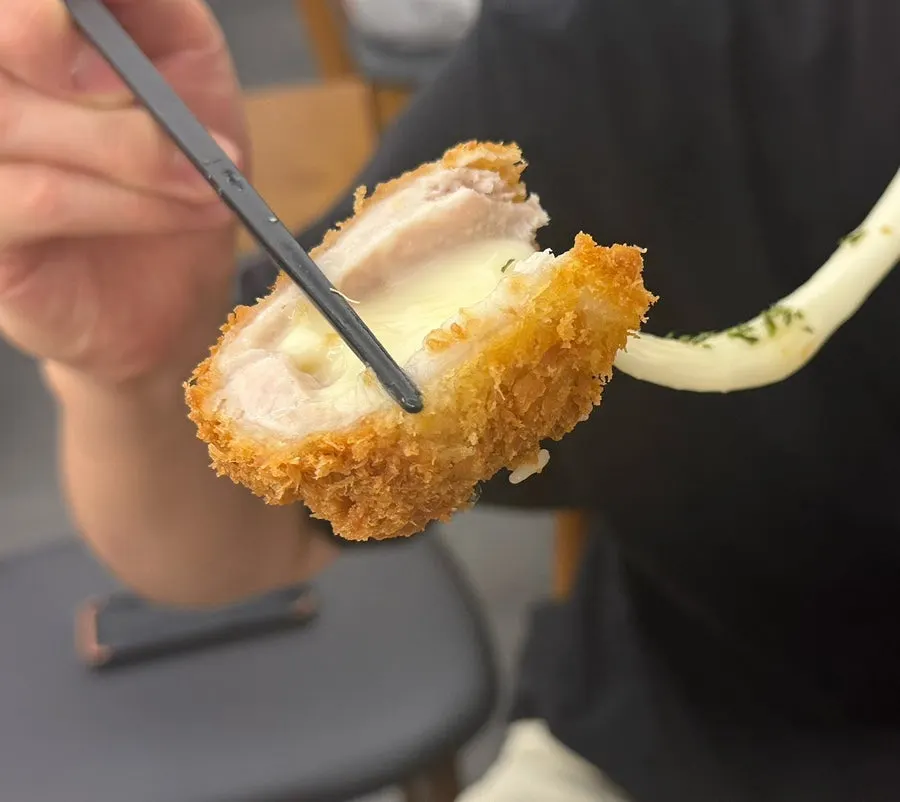 Cheese stretching long from the cheese katsu