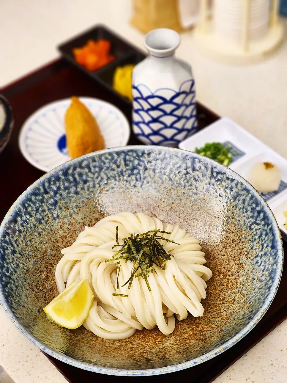 Bukkake udon noodles coiled into a bundle