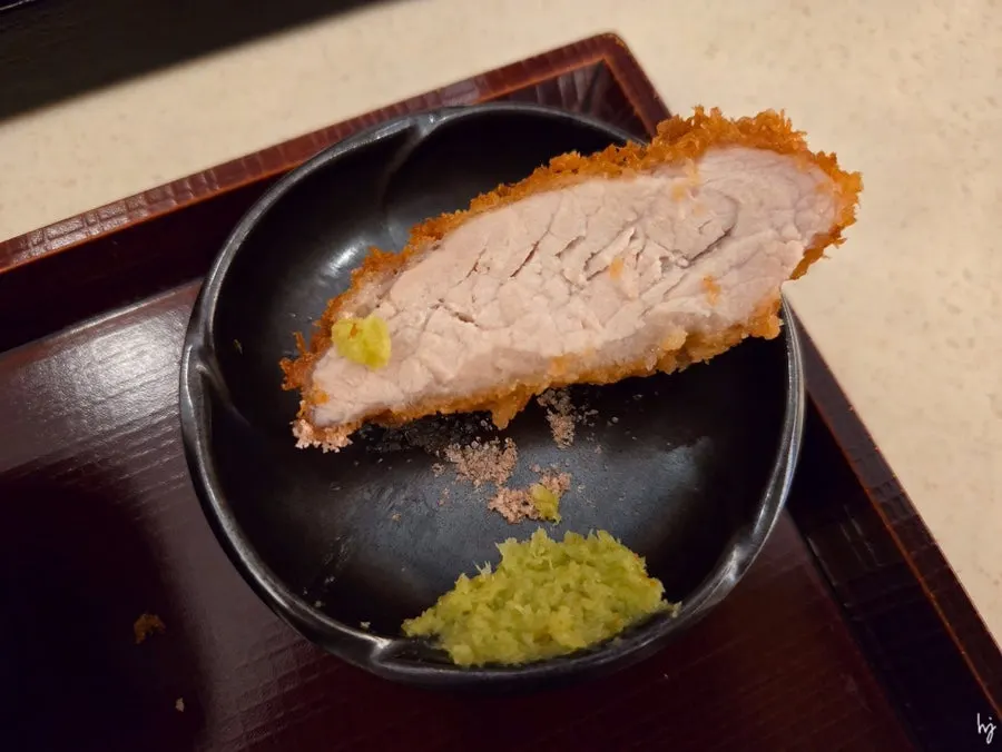 A piece of tonkatsu with salt and wasabi