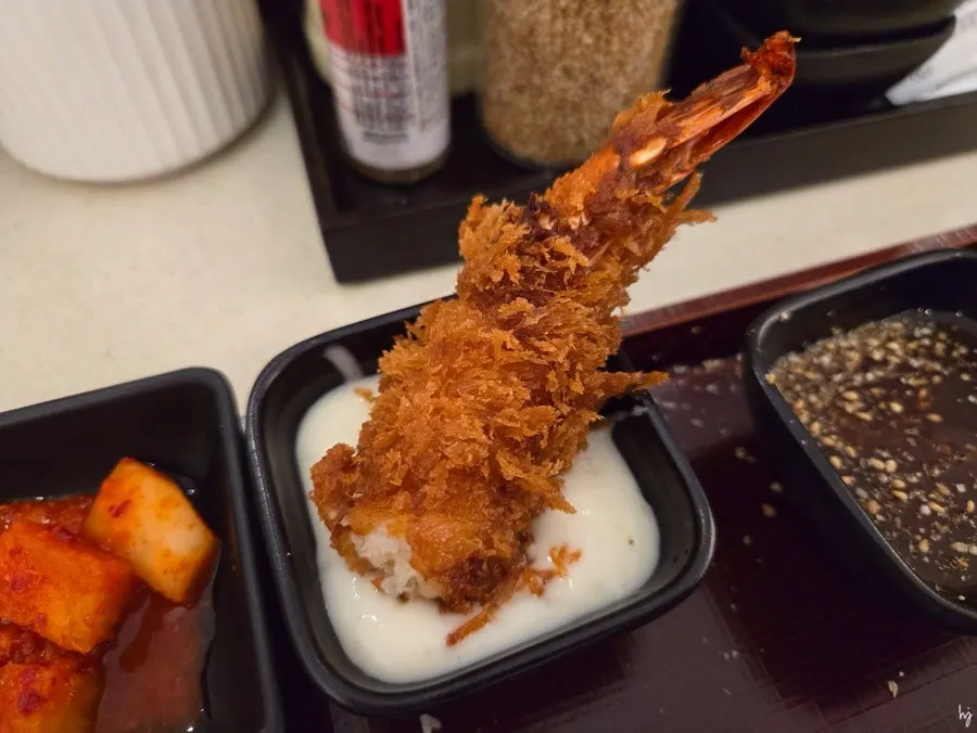 King shrimp katsu with head removed, served with sauce