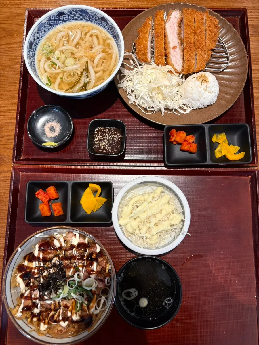 Menu board with tonkatsu, udon, and donburi at Kosi Gyodae Branch