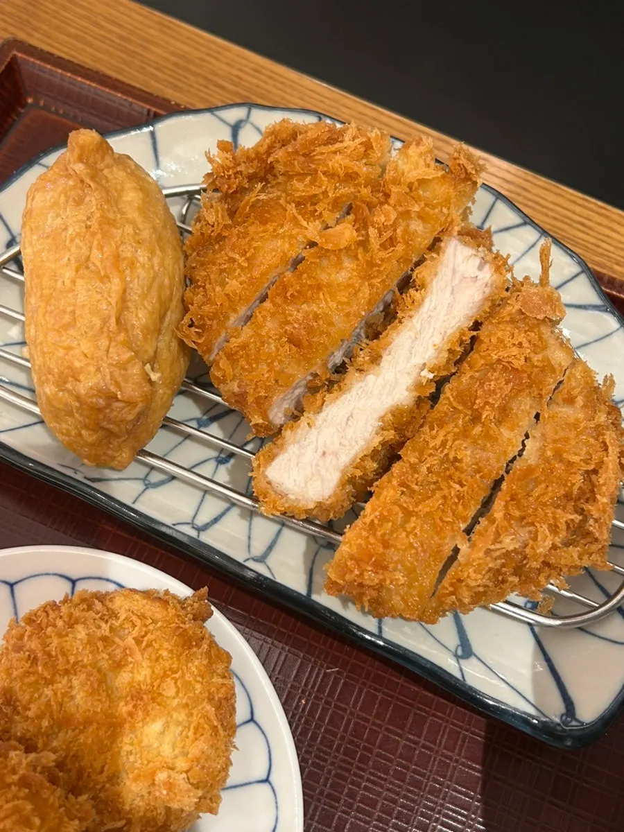 Chewy udon noodles lifted with chopsticks