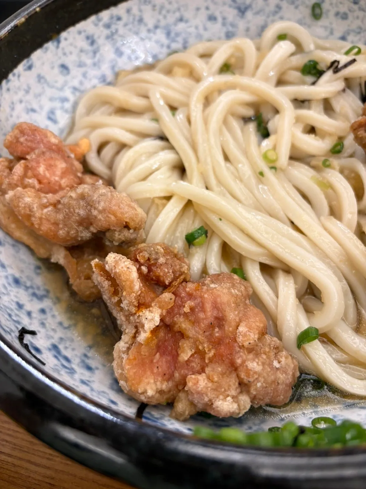 Bukkake udon mixed soupy with poured sauce