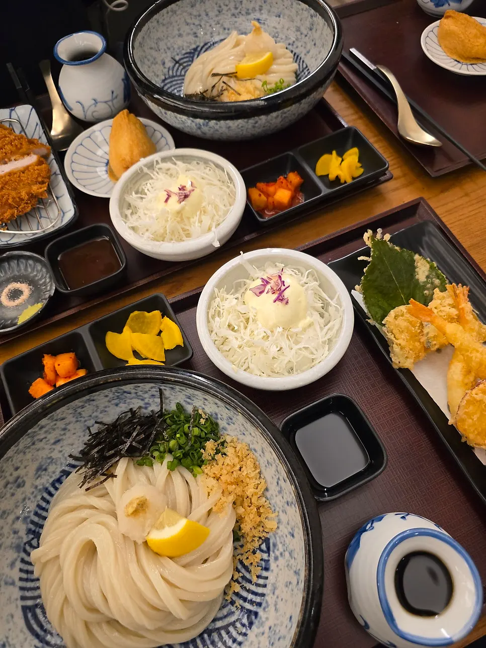 Full spread with pickled radish, kkakdugi, salad, and inari sushi